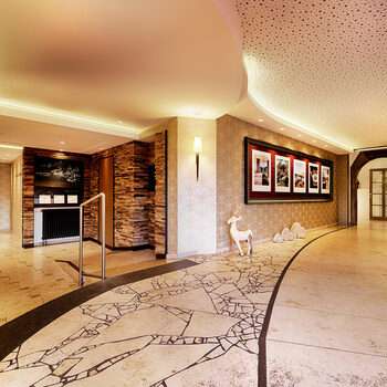 beige hallway that splits into two directions.