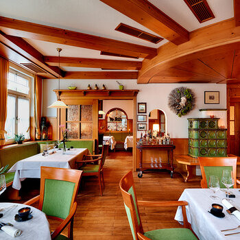 Tables set in the traditional ambience of the Berlins Krone gourmet restaurant.